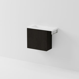 Aria 550 wall-hung WC vanity in Dark Ash timber with an offset basin and integrated Brushed Nickel hand towel rail, shown against a white background.