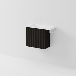 Aria 550 wall-hung WC vanity in Dark Ash timber with an offset basin and integrated Matte White hand towel rail, shown against a white background.