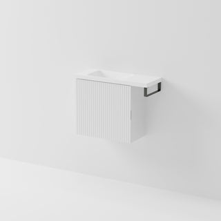 Aria 550 wall-hung WC vanity in Matte White with an offset basin and integrated Gunmetal hand towel rail, shown against a white background.