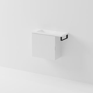 Aria 550 wall-hung WC vanity in Matte White with an offset basin and integrated Matte Black hand towel rail, shown against a white background.