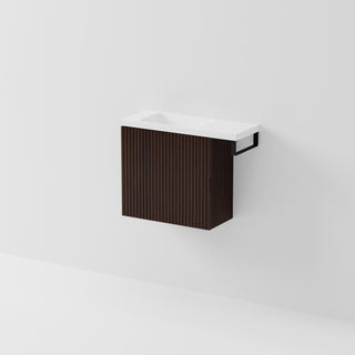 Aria 550 wall-hung WC vanity in Walnut Ash timber with an offset basin and integrated Matte Black hand towel rail, shown against a white background.