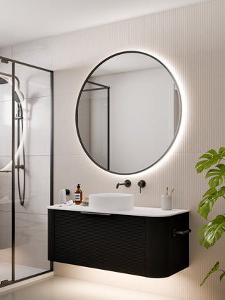 code-interiors-gunmetal-aura-round-led-mirror-in-bathroom-setting