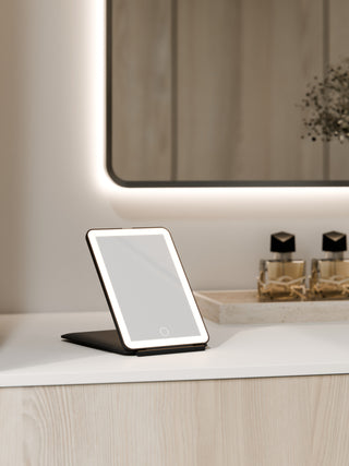 solace-travel-led-mirror-in-matte-black-in-powder-room-setting-render