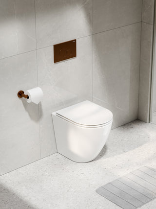 code-flow-typhoon-in-the-wall-gloss-white-toilet-suite-brushed-copper-button-tiled-wall